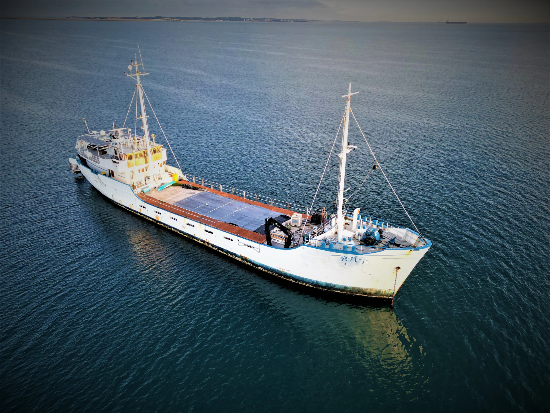 a large boat floating on top of a large body of water