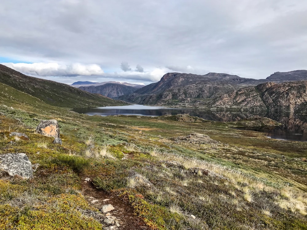 a scenic view of a lake in the mountains