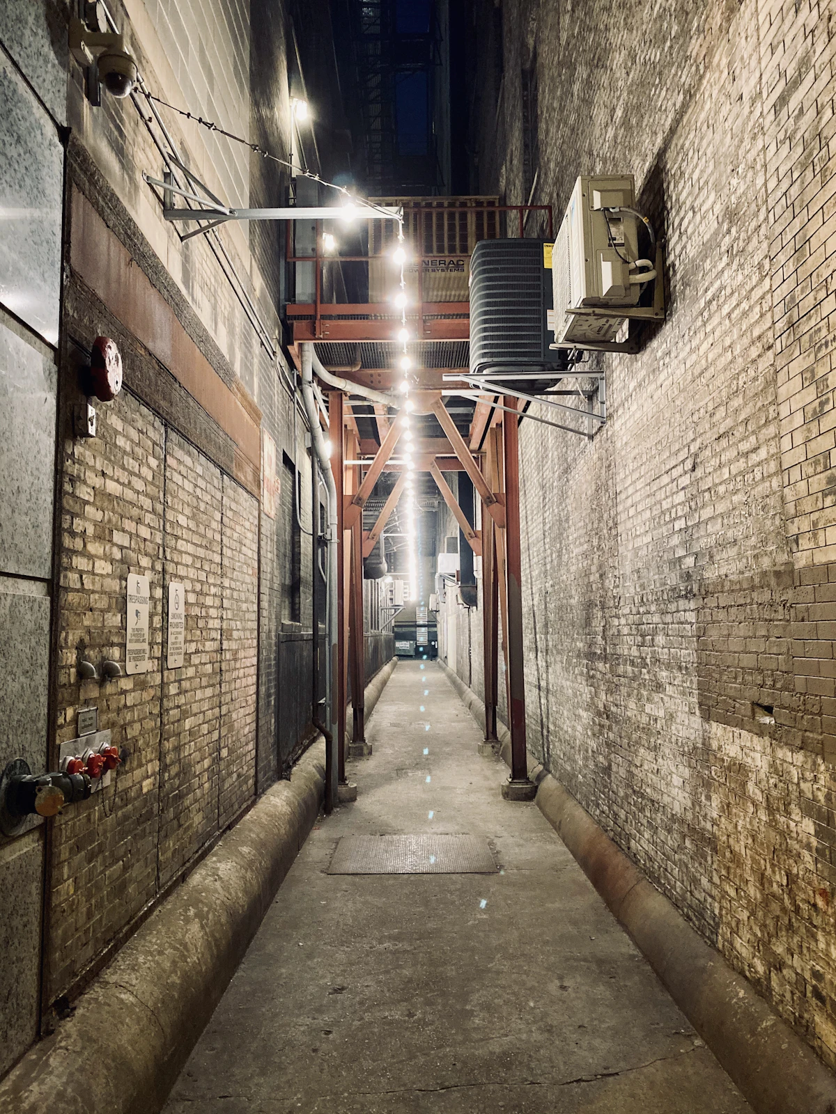 Brick alley lit at night in Chicago