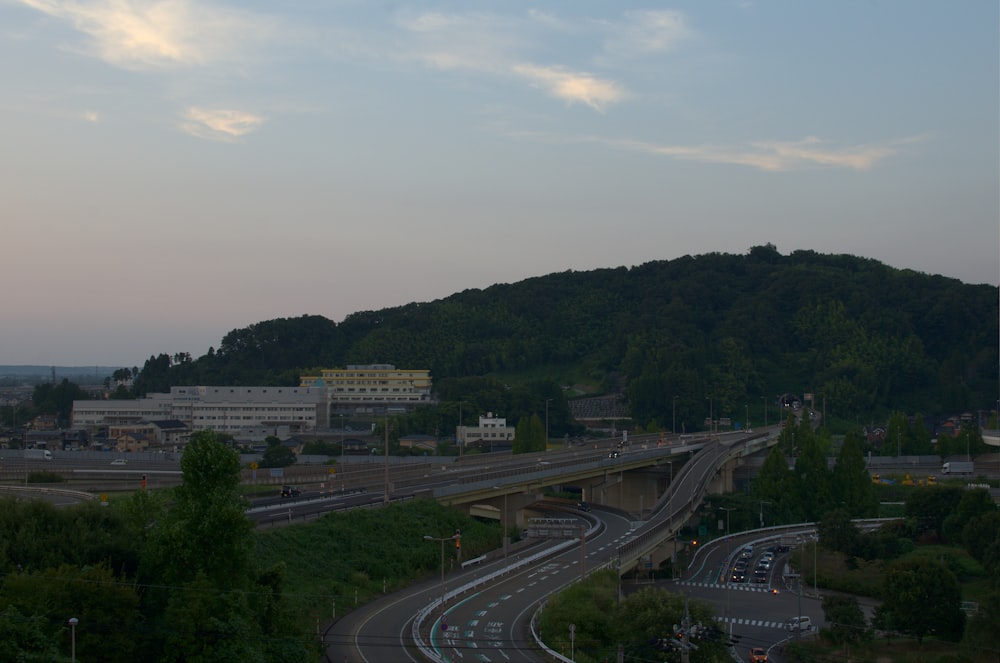 a view of a highway with a mountain in the background