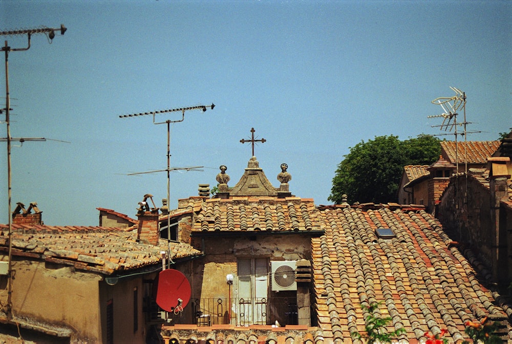 a view of a rooftop of a building with tiled roofs