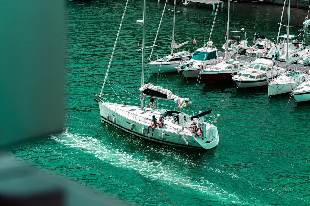 a group of boats floating on top of a body of water