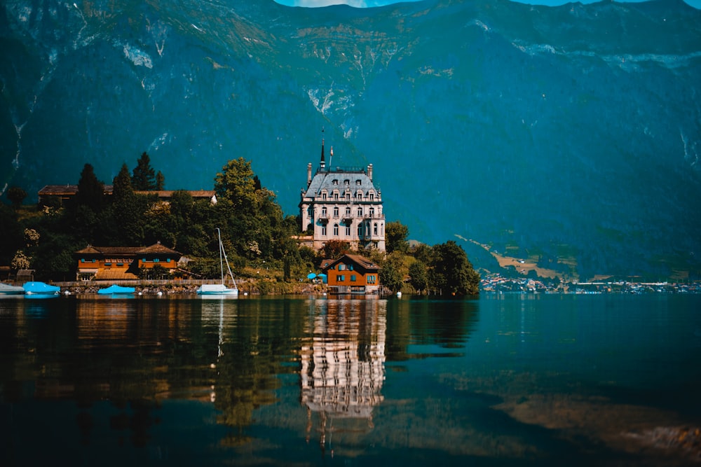 a house on a small island in the middle of a lake