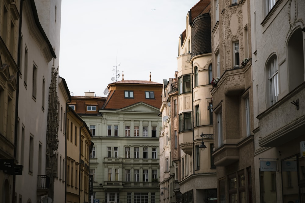 a narrow city street lined with tall buildings