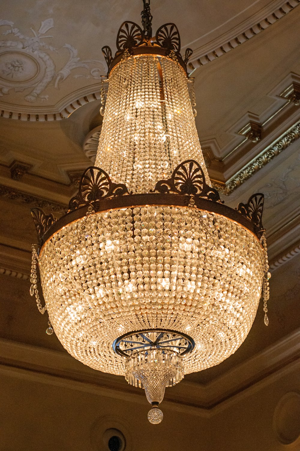 a chandelier hanging from a ceiling in a room