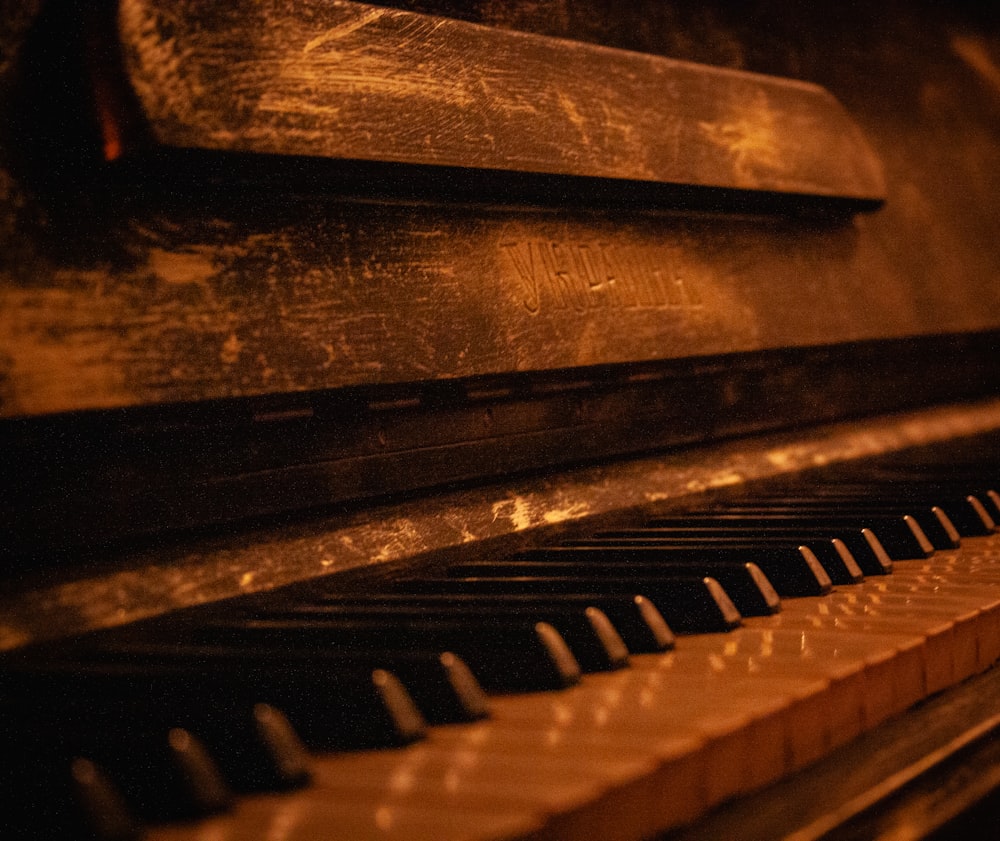 a close up of a piano in a dark room