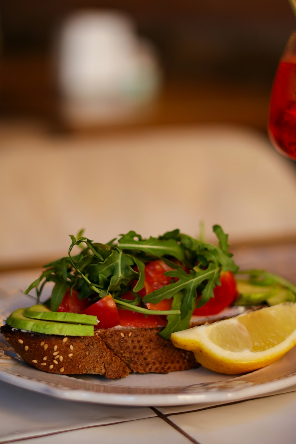 a plate of food on a table with a glass of wine