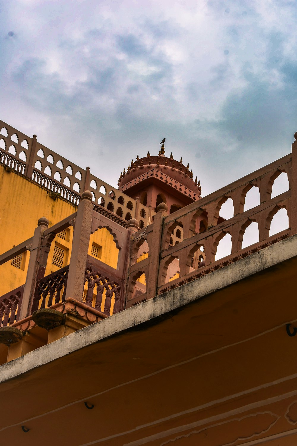 a balcony with a clock on the top of it