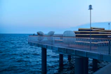 Detail of stainless steel fixtures on a contemporary pier, emphasizing quality craftsmanship.