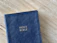 Close-up of a beautifully bound Bible with a leather cover on a wooden table.