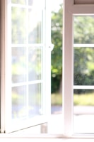 A large window gleaming with clarity after a careful cleaning in a cozy home setting.