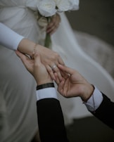 Close-up of hands gently holding a contract, representing personalized and clear funeral plans.