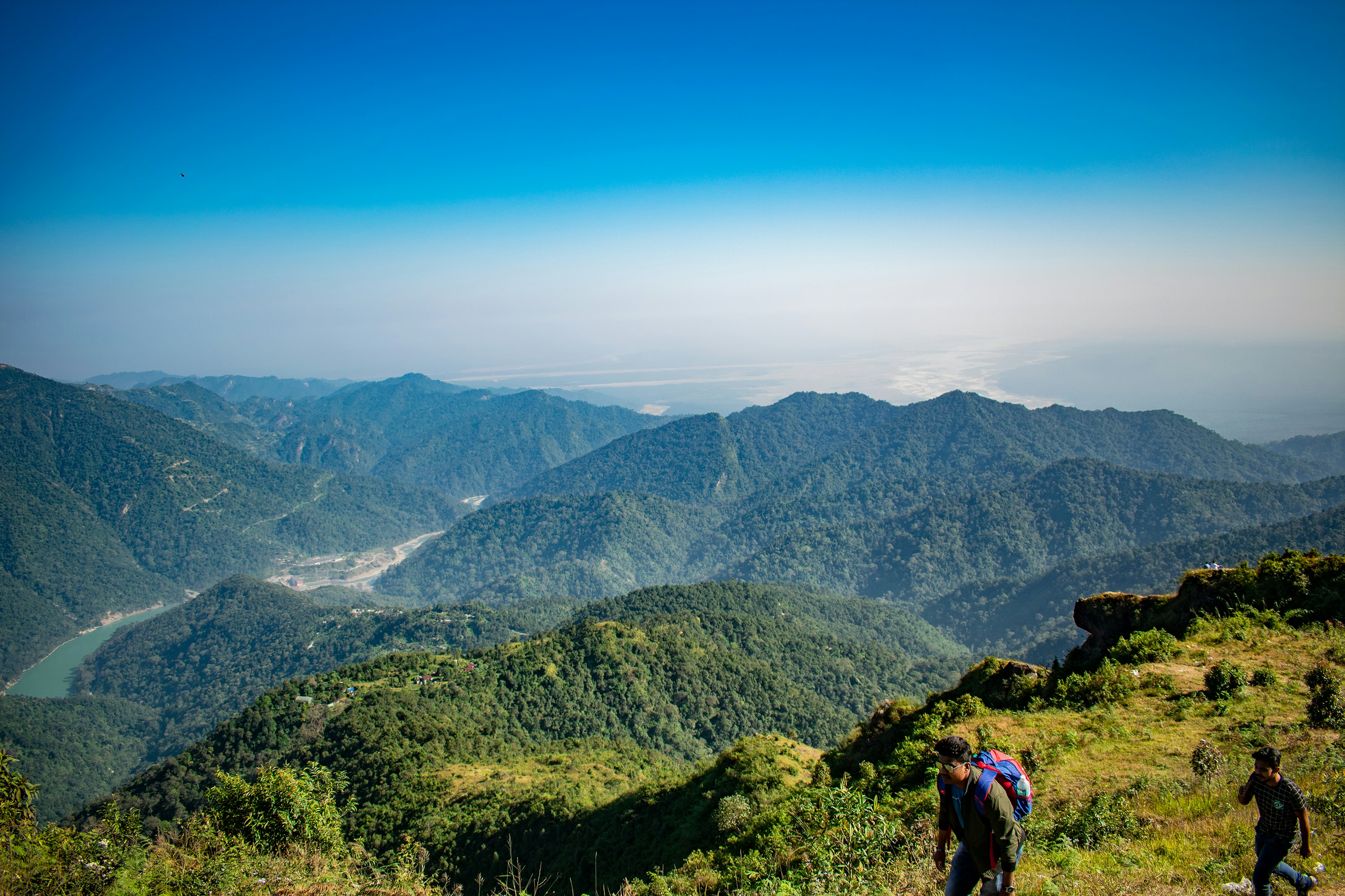 a group of people hiking up the side of a mountain