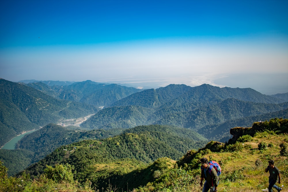 a group of people hiking up the side of a mountain