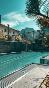 a large swimming pool next to a building