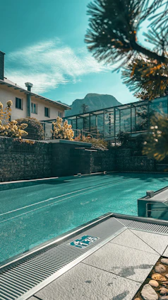 a large swimming pool next to a building