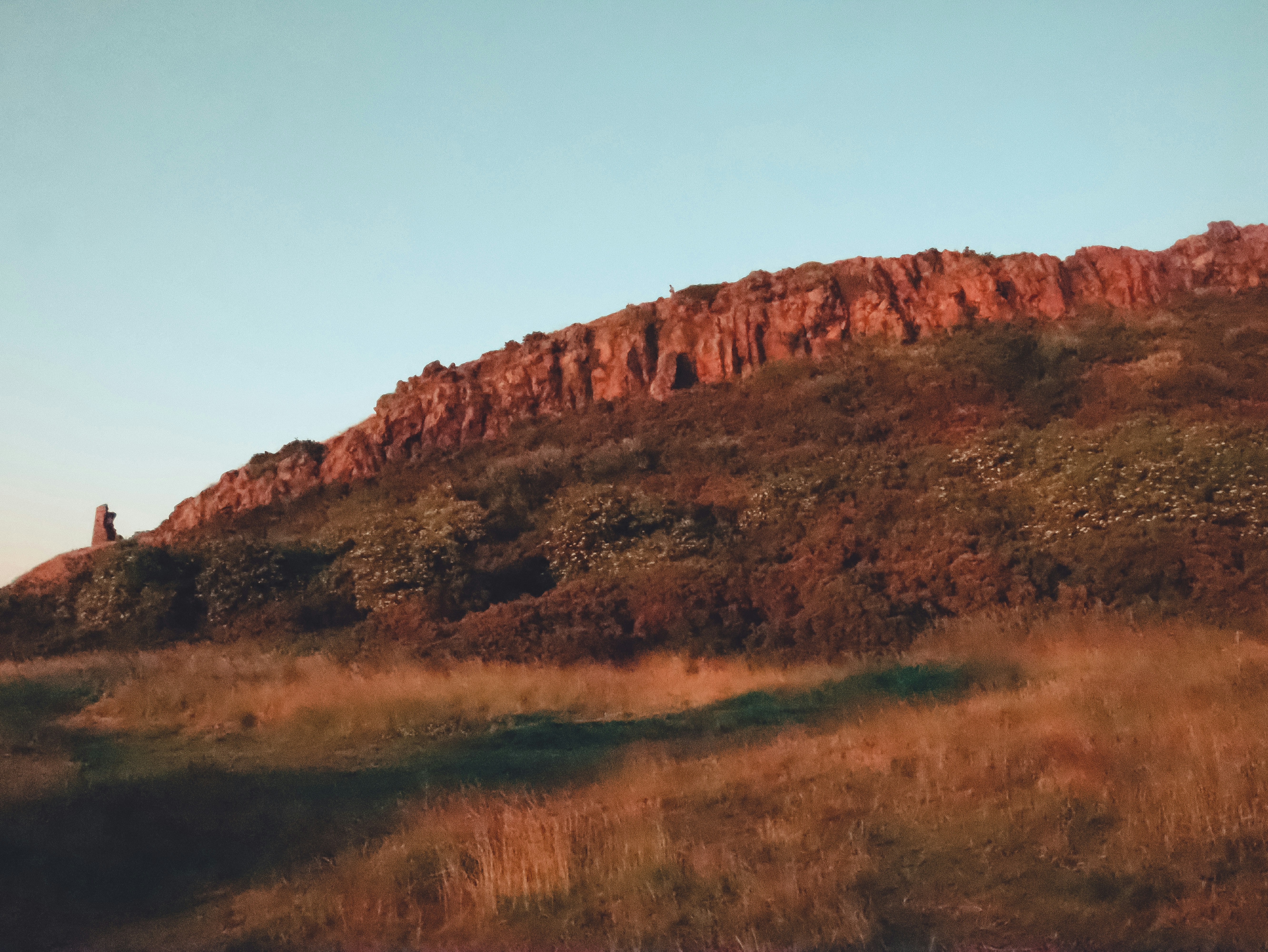 a hill with a tower on top of it