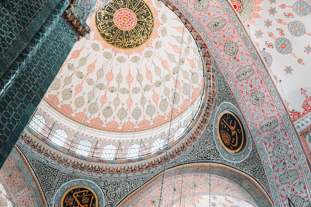 the ceiling of a building with intricate designs