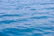Calm and expansive water surface with gentle ripples reflecting the blue of the sky.