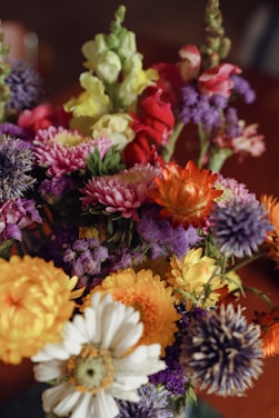 A beautiful flower arrangement showcasing various types of blooms.