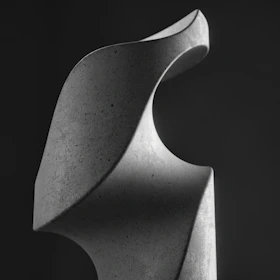 A minimalist sculpture captured in soft natural light, emphasizing clean lines and elegant form from an asho award recipient.