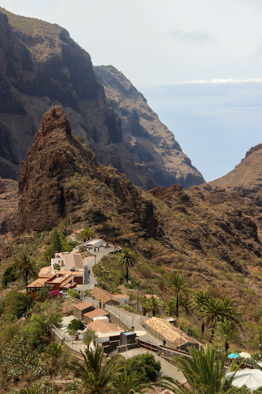 a view of a mountain with a village in the foreground