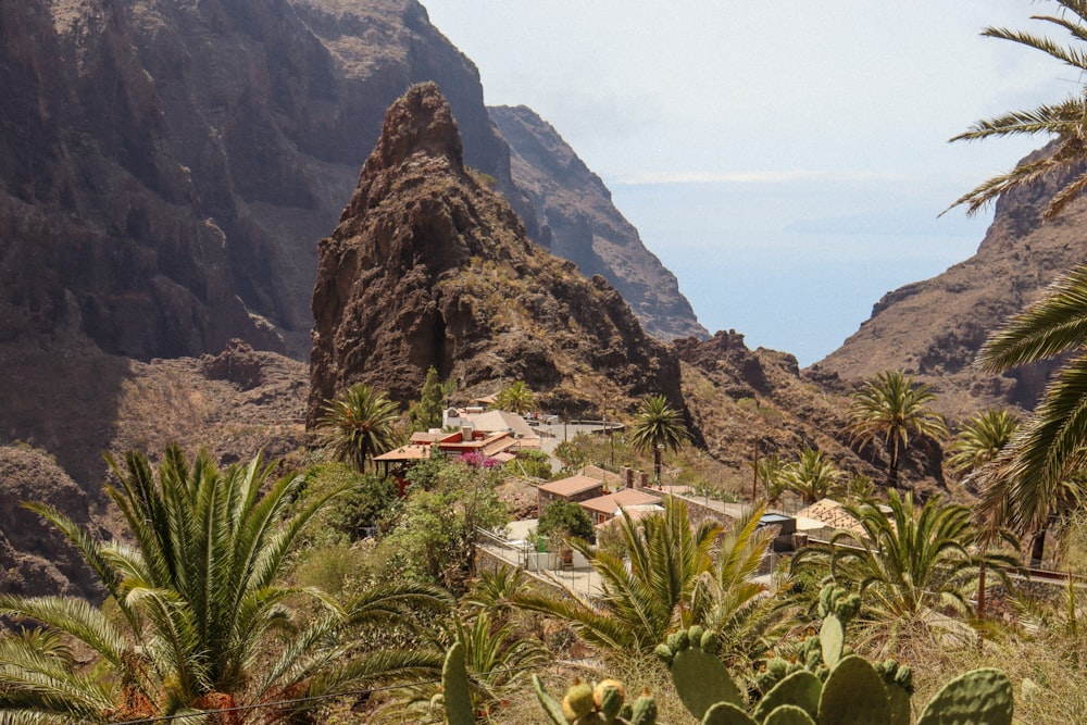 a view of a mountain with a house in the middle of it