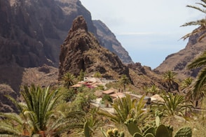 a view of a mountain with a house in the middle of it