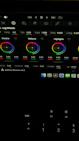 Close-up of a color grading workspace with DaVinci Resolve interface on screen, showcasing vibrant color wheels.