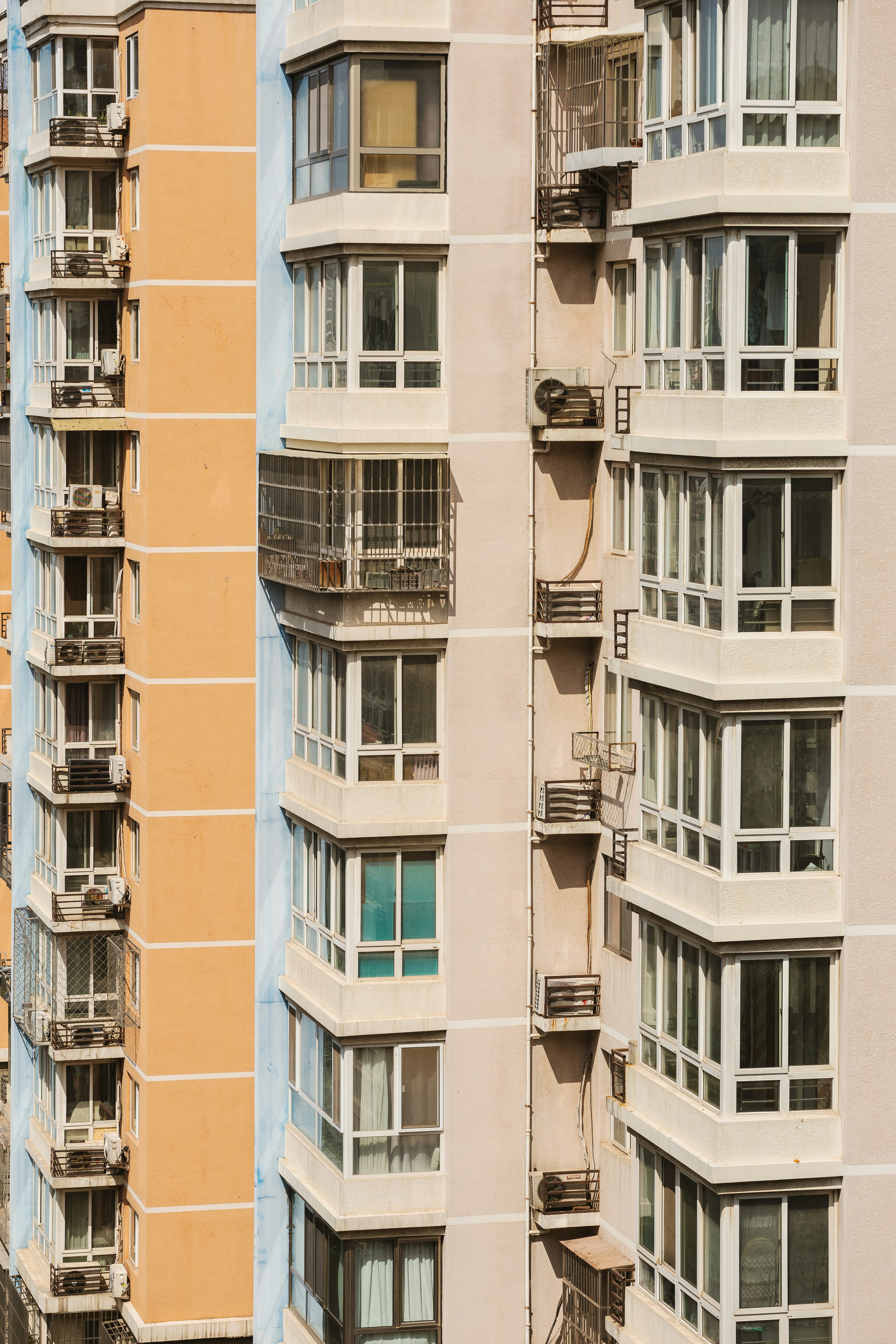 a tall building with multiple balconies and windows