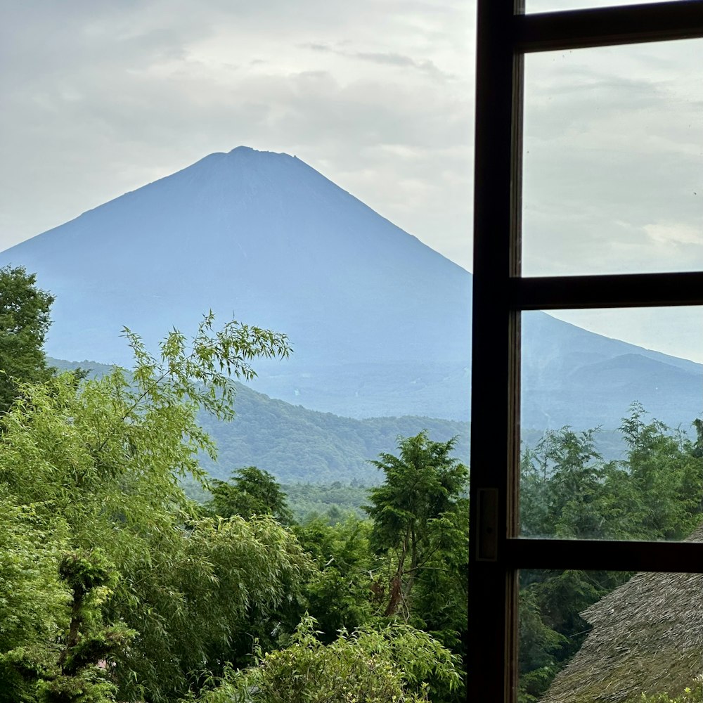 a view of a mountain from a window