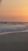 A tranquil beach at sunset, evoking relaxation and peace.