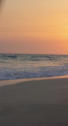 A serene beach scene at sunset, evoking tranquility and reflection.