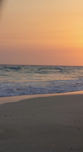 A serene beach scene at sunset, inviting relaxation and escape.