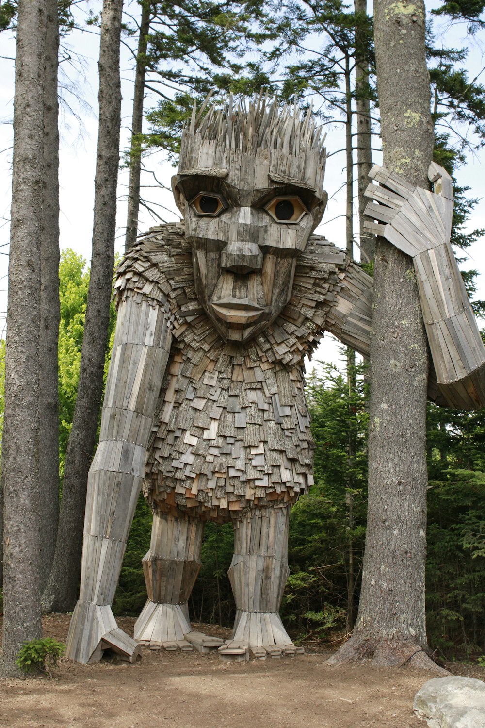 a statue of a man made out of wood