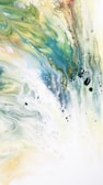 A fluid abstract composition featuring swirling patterns of blues, greens, yellows, and whites. The textures resemble flowing water or marble with hints of bubbles and speckles throughout.