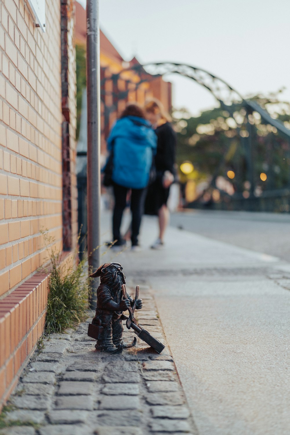 a toy soldier is sitting on the side of the road