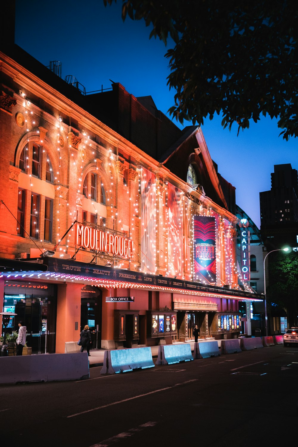 a large building with lights on the side of it