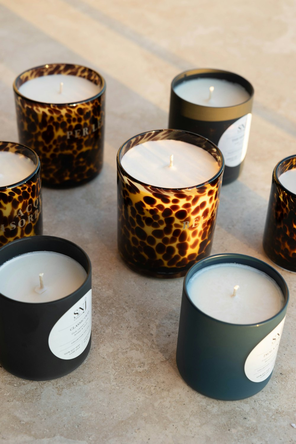 a group of candles sitting on top of a table