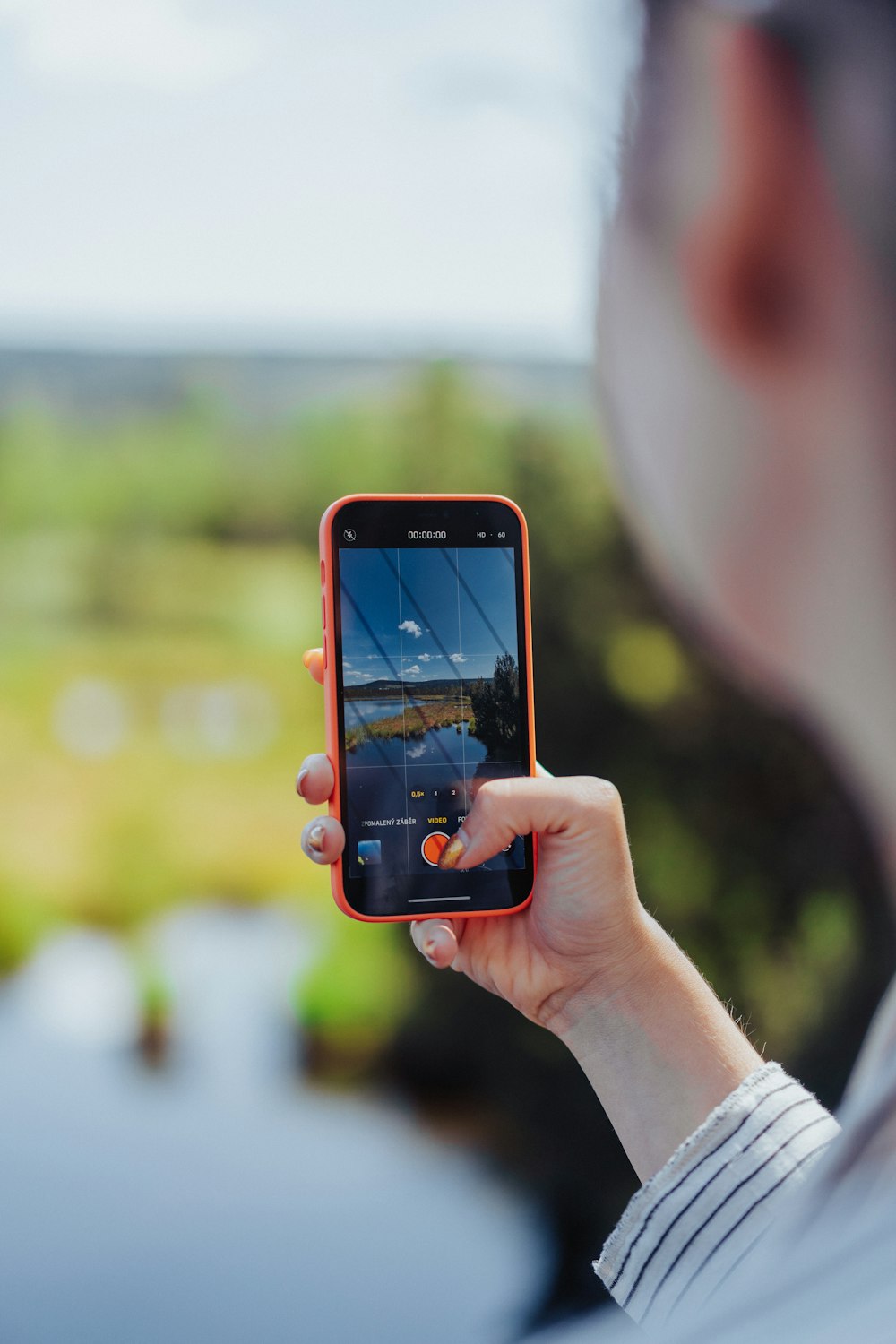 a person taking a picture with a cell phone