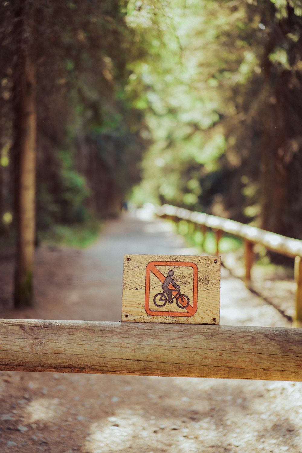 a sign that is sitting on a wooden bench