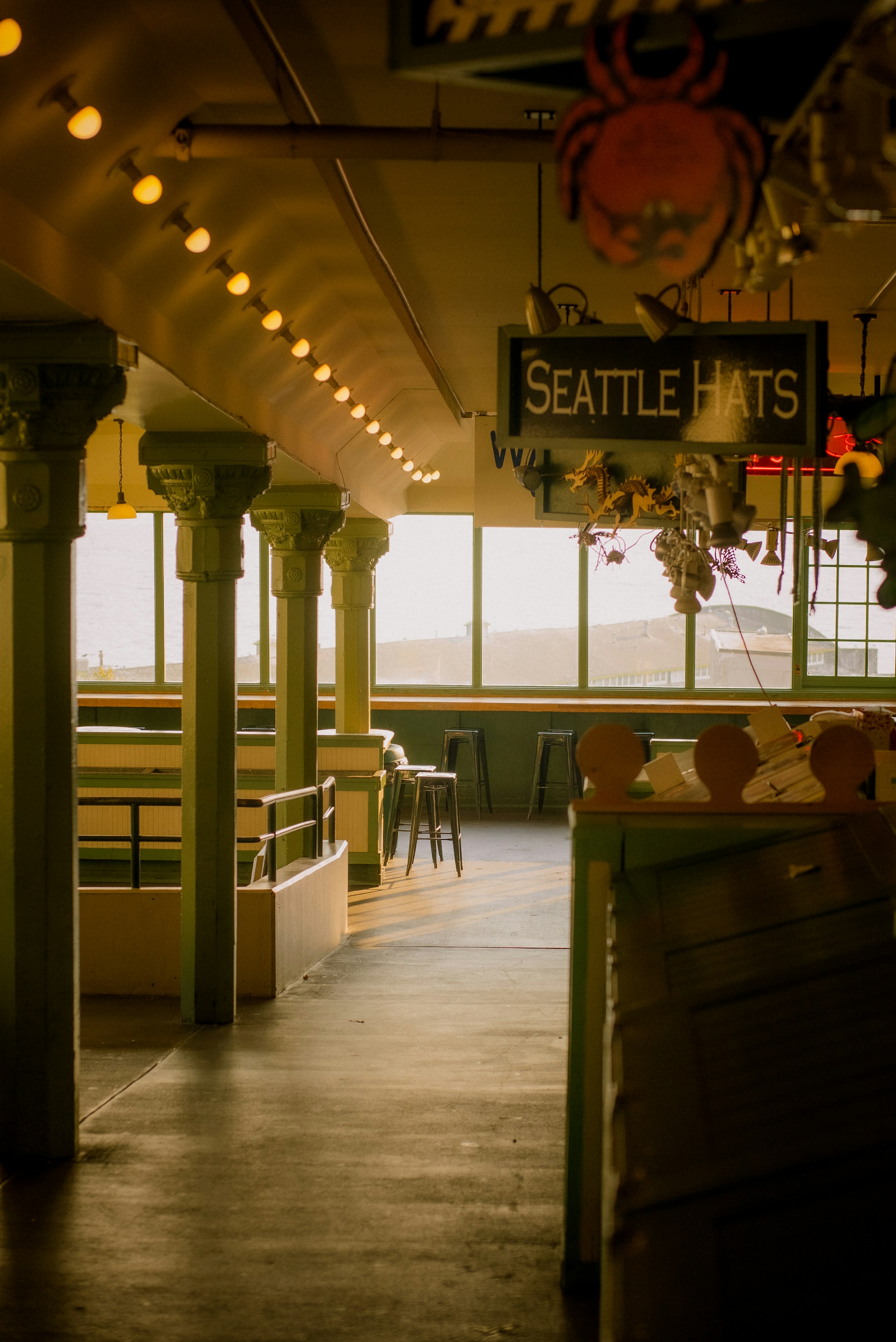 a restaurant with a sign that says seattle hats