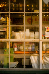 A sparkling clean storefront window with the Santa Cruz Window Shine logo in the corner