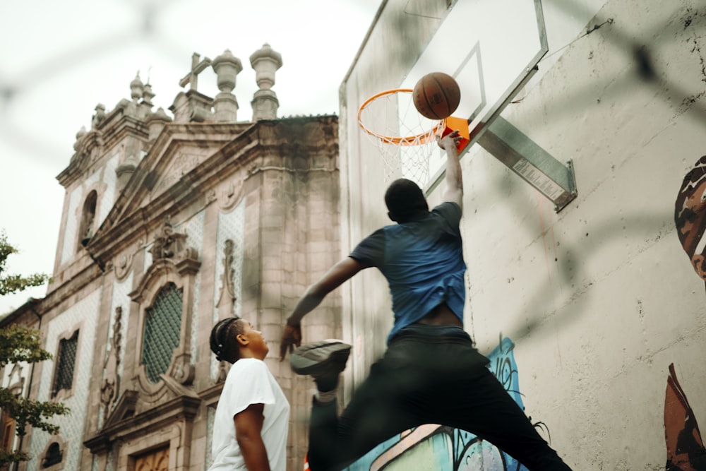 a couple of men playing a game of basketball