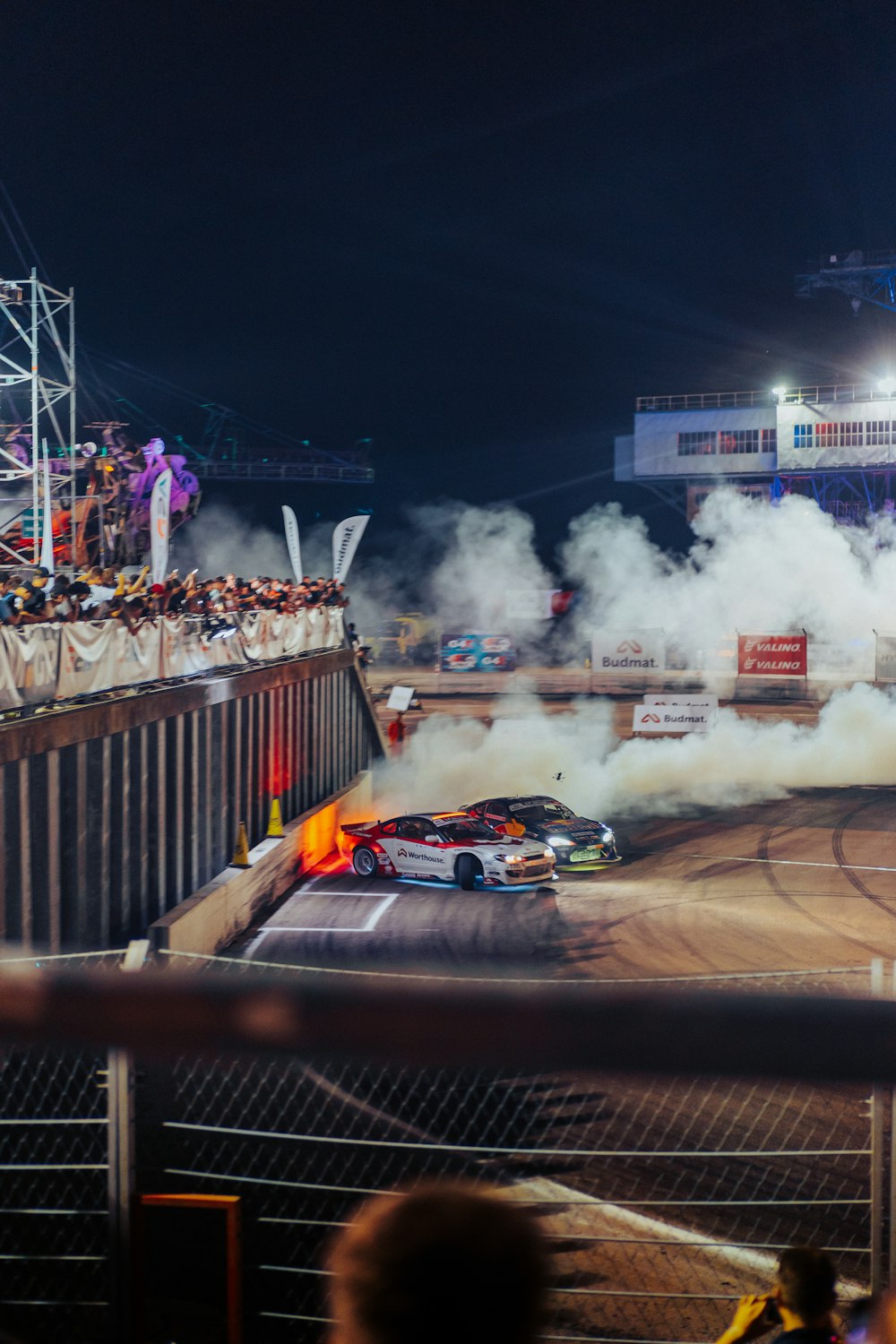 a car that is on a track with smoke coming out of it