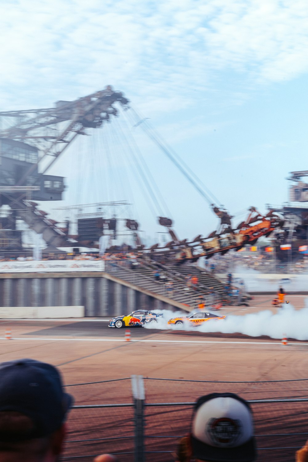 a group of people watching a race on a track