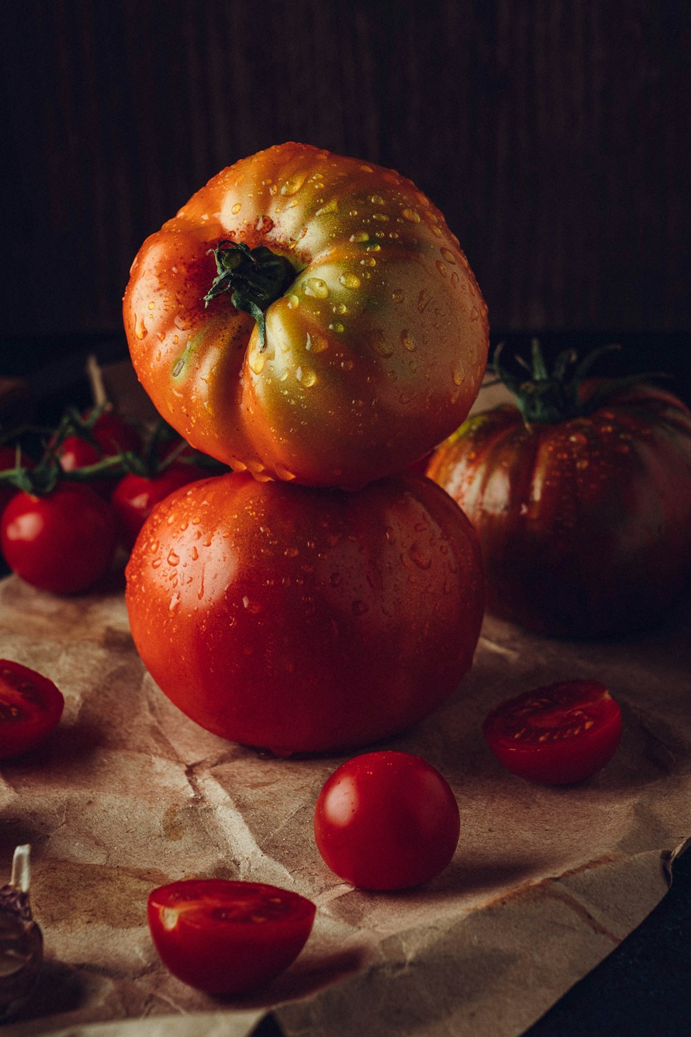 a pile of tomatoes sitting on top of a piece of paper
