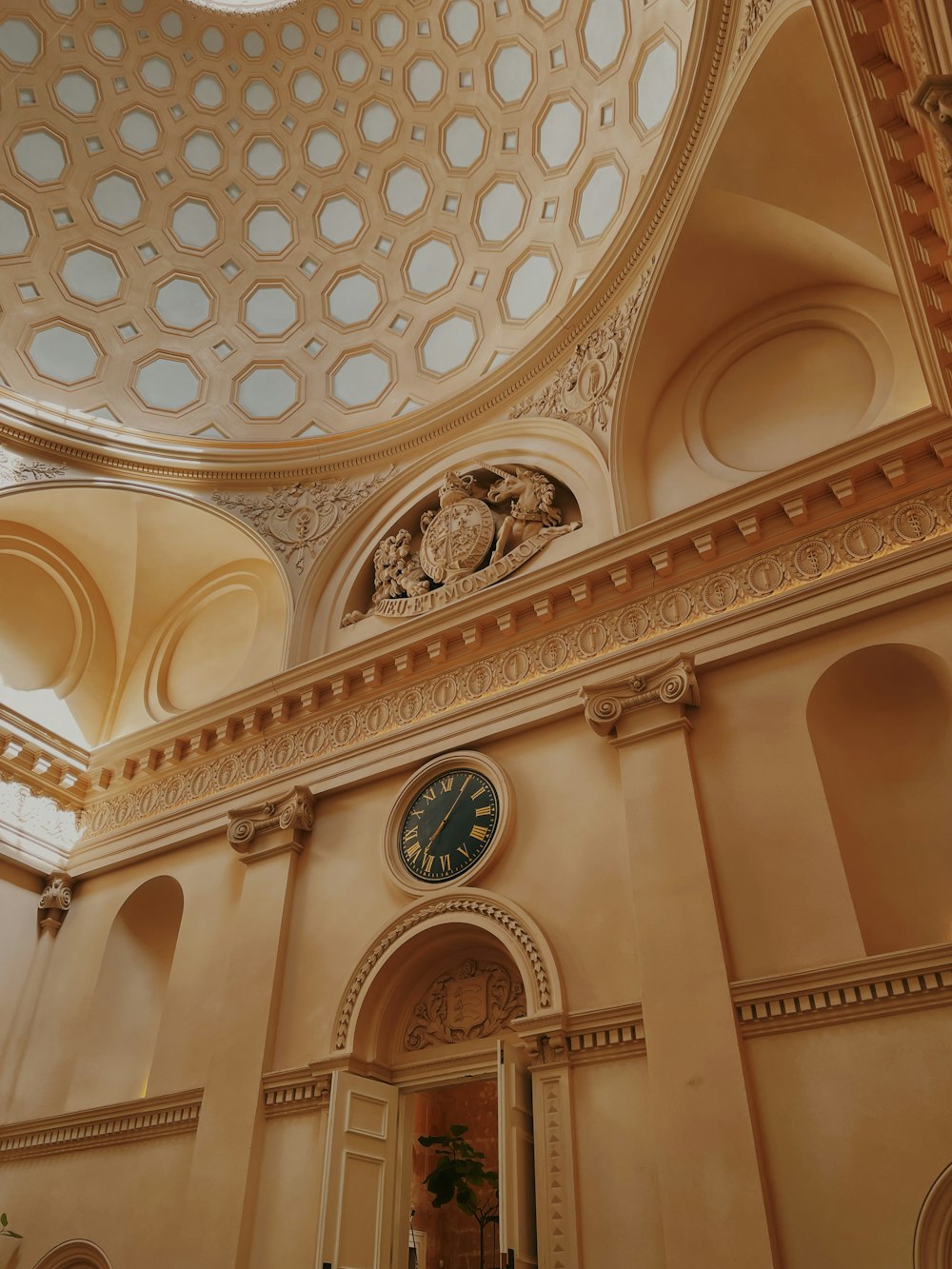 a clock mounted to the ceiling of a building