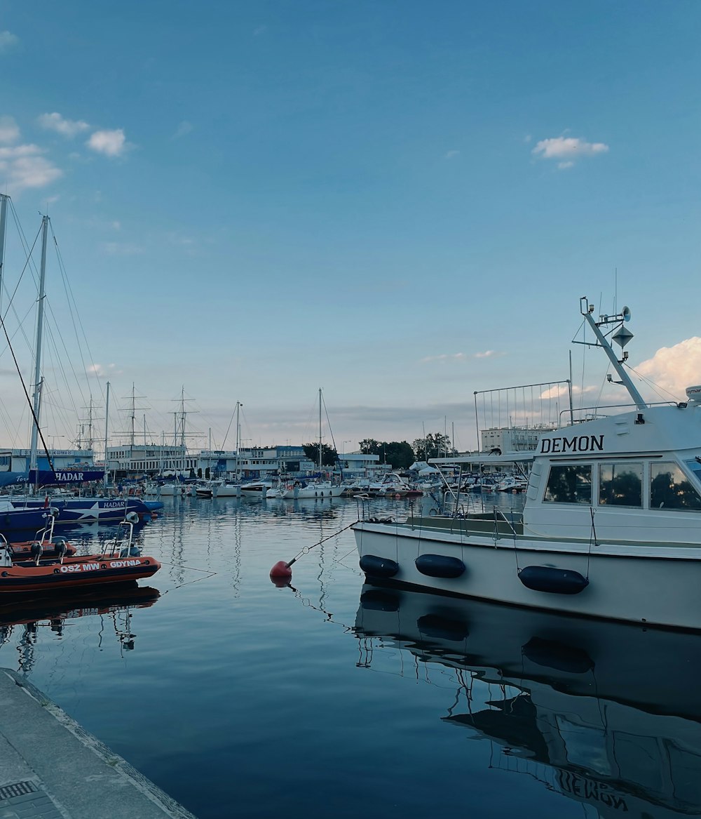 a harbor filled with lots of boats under a blue sky