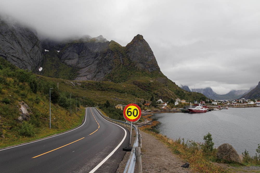 a speed limit sign on the side of a road